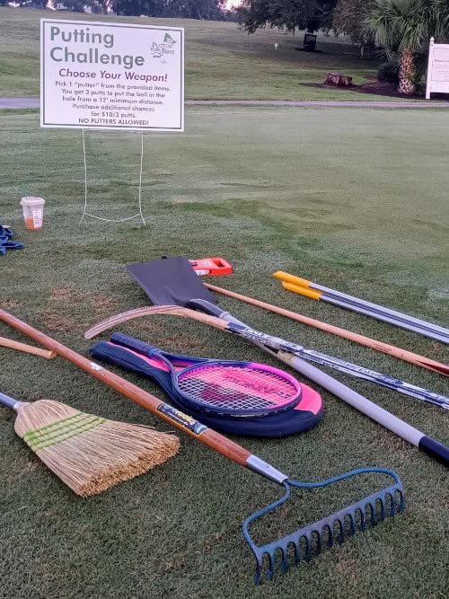 A broom, shovel and rake are some of the tools pictured for use in a fun putting challenge.