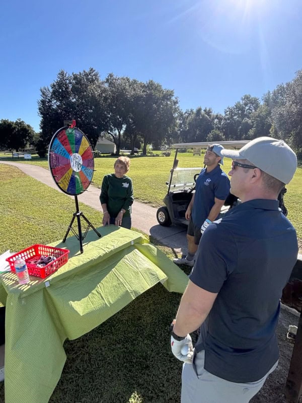 Players spin the "Hole of Fortune" wheel to win raffle tickets and prizes, or risk a forfeit such as having to wear their T-shirt backwards!